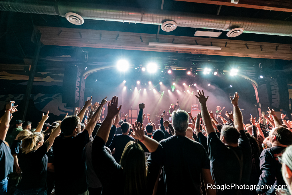 Crowd raising hands up at Corrosion of Conformity concert