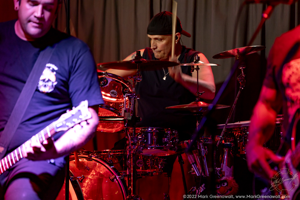 Drummer Ando Miller performing with Drop D