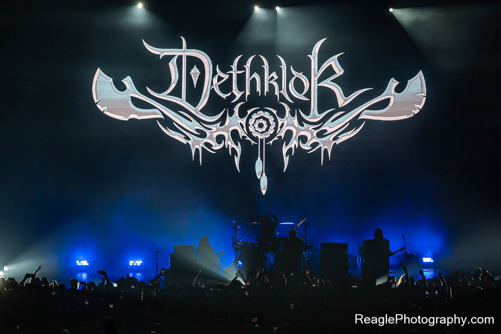Dethklok logo on the backing screen at their concert