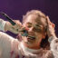 Closeup of Gerard Way of Chemical Romance singing live with an emotive facial expression