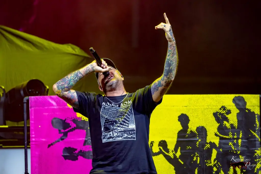 Jordan Pundik (vocals), New Found Glory tilting his head back and pointing his finger upward as he sings